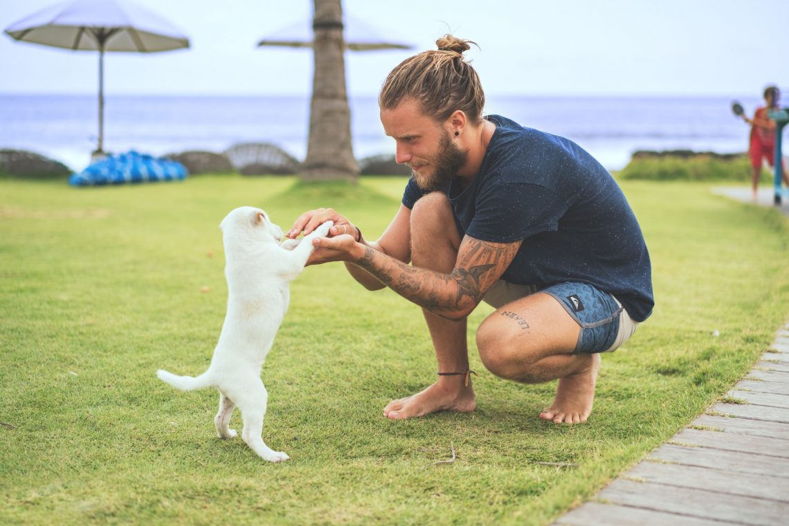 man with puppy